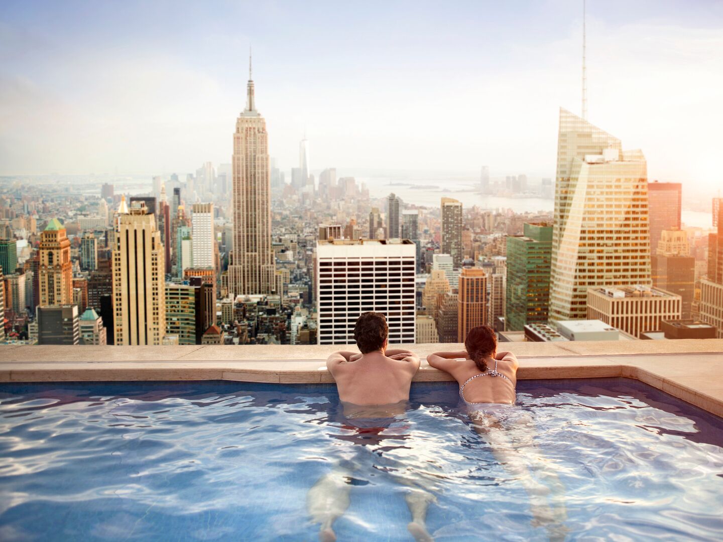 Couple relaxing on hotel rooftop