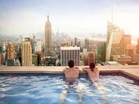 Couple relaxing on hotel rooftop
