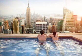 Couple relaxing on hotel rooftop
