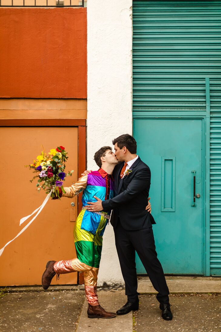 Groom in Colorful Jumpsuit Kissing Partner in Suit