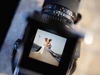 Bride and groom being photographed
