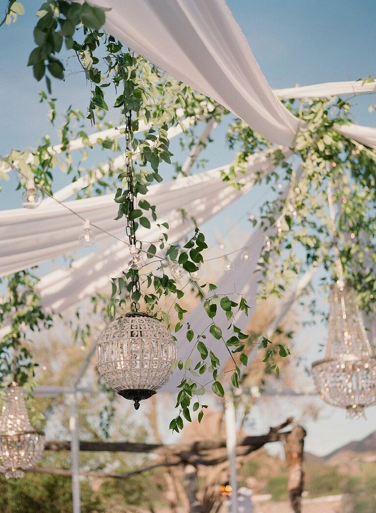 Open-air tent with glass globe chandelier