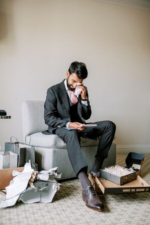 Groom in Dark Gray Suit Reading Wedding Day Card and Crying