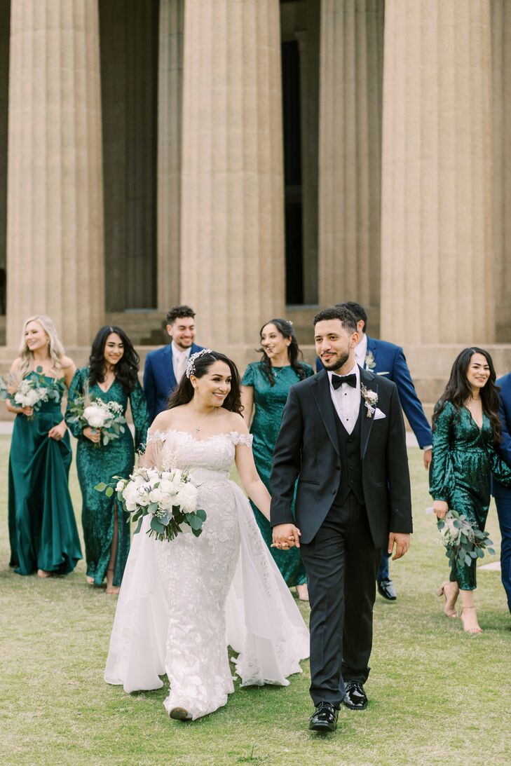 Couple Holding Hands and Walking With Wedding Party at The Parthenon in Nashville, Tennessee