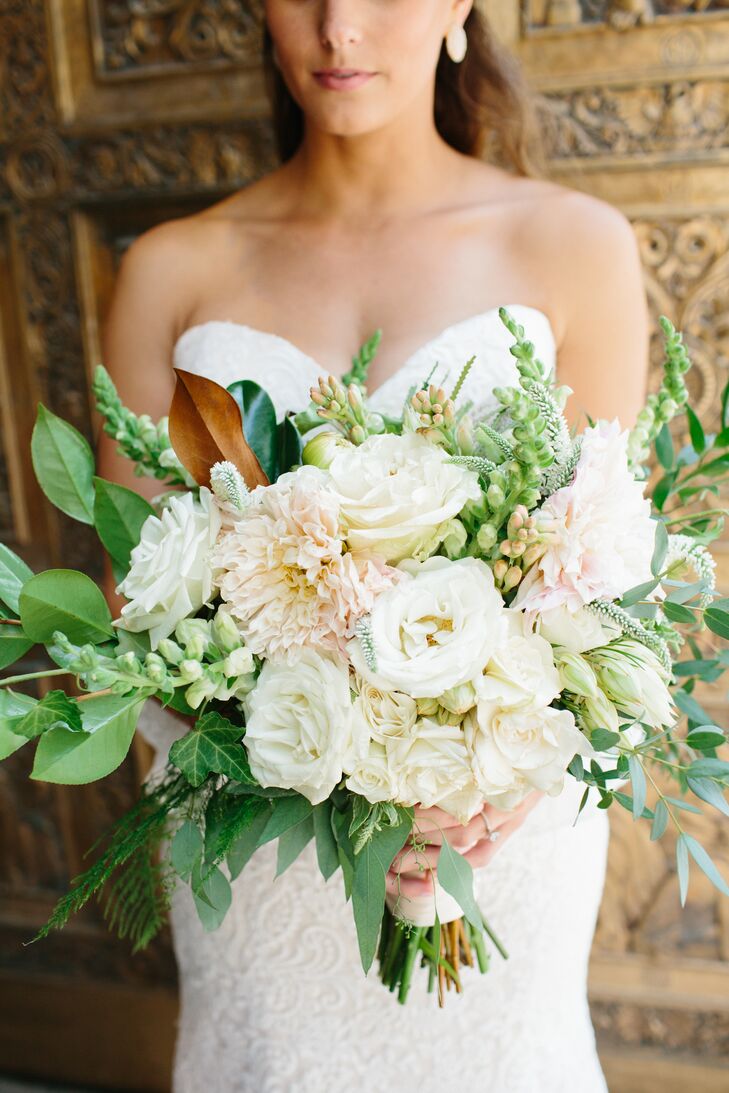"I am still so in love with my bouquet," Claire says. "I kept it in a vase in our dining room for two weeks after the wedding, until I was forced to throw it away because it was in such bad shape." Brianna from Fox & Fern Floral, included roses, dahlias, sweet peas, blushing bride proteas and magnolia leaves in the stunning, textured bouquet.