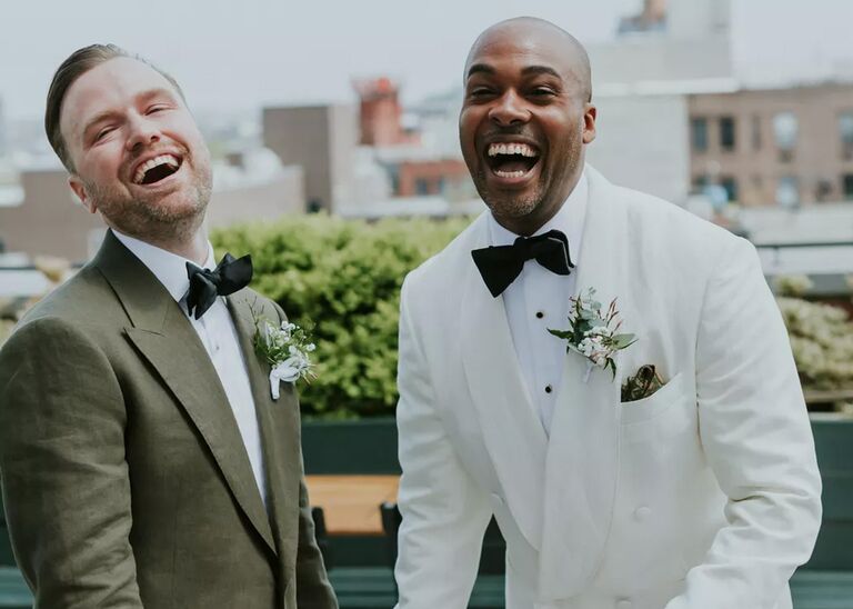 Two men laughing on wedding day
