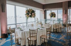 Classic Ballroom Reception with Ivory Linens and Gold Chiavari Chairs