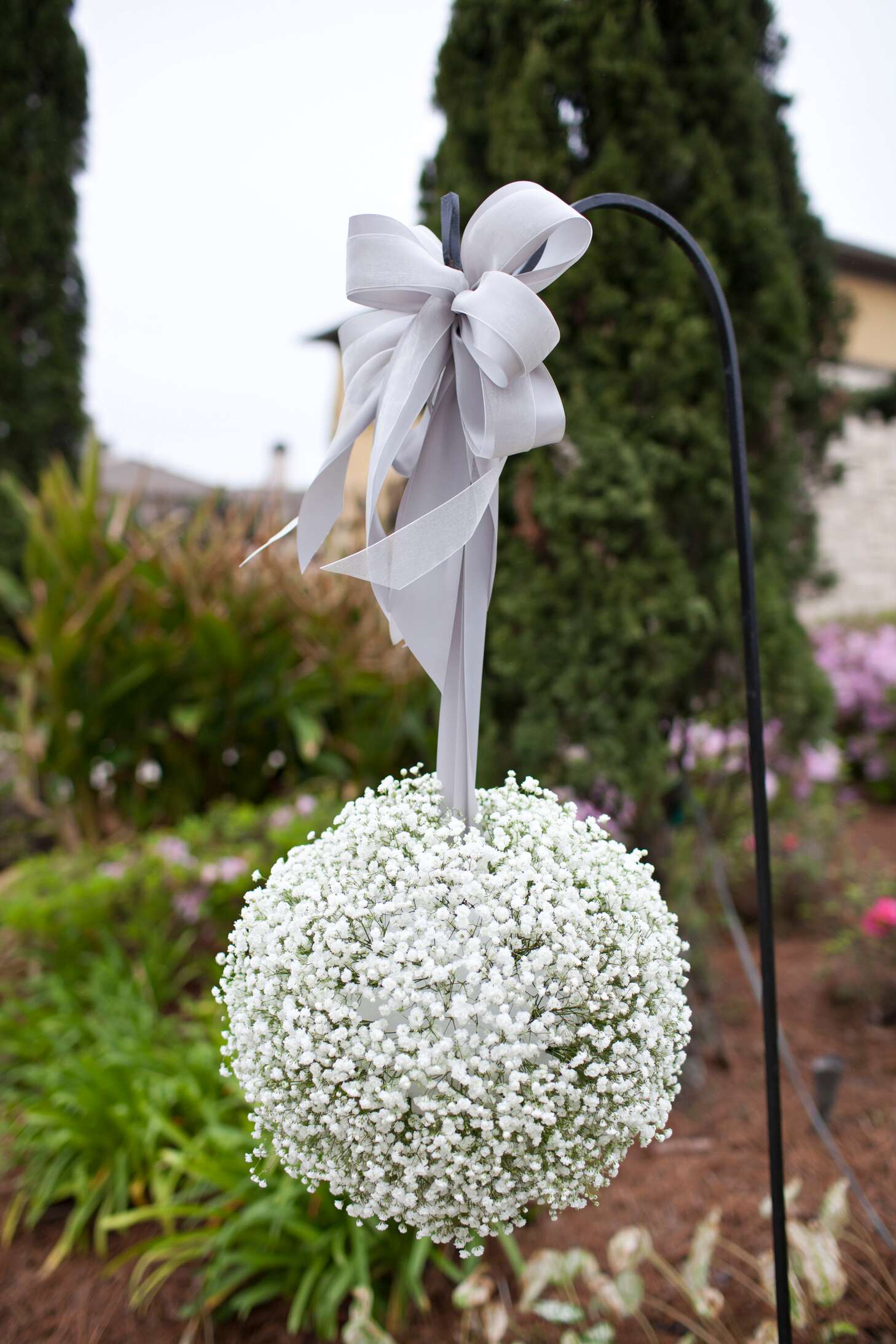 hanging baby's breath pomander with silver ribbon