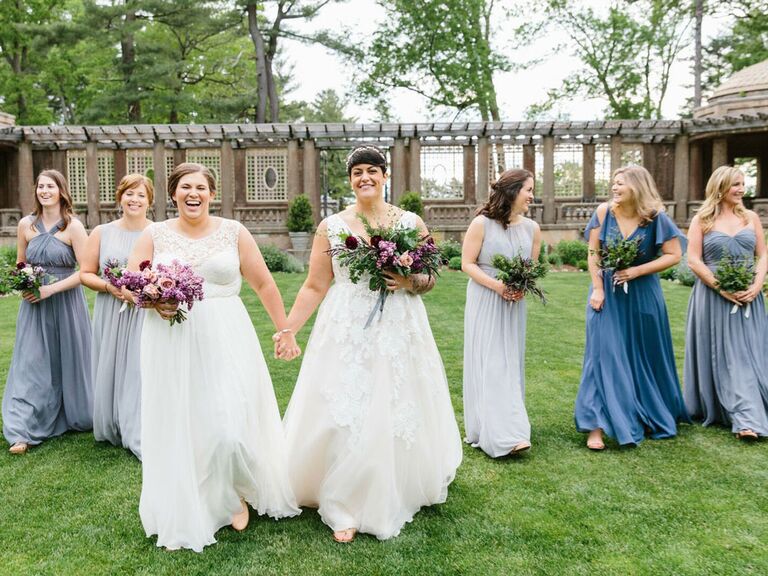 Brides walking to ceremony with bridesmaids