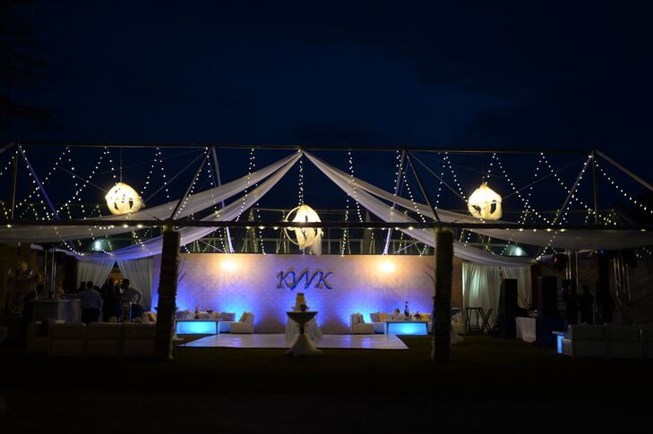 The reception took place in a romantic tented area outside of the Pedro St. James Castle on the island of Grand Cayman.