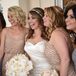 Sticking to a neutral palette, Sarah dressed her bridesmaids in beaded, floor-length Adrianna Papel gowns in blush or slate gray.