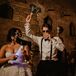 Bride and Groom in Italian Abbey Dance With Glow Sticks at Reception