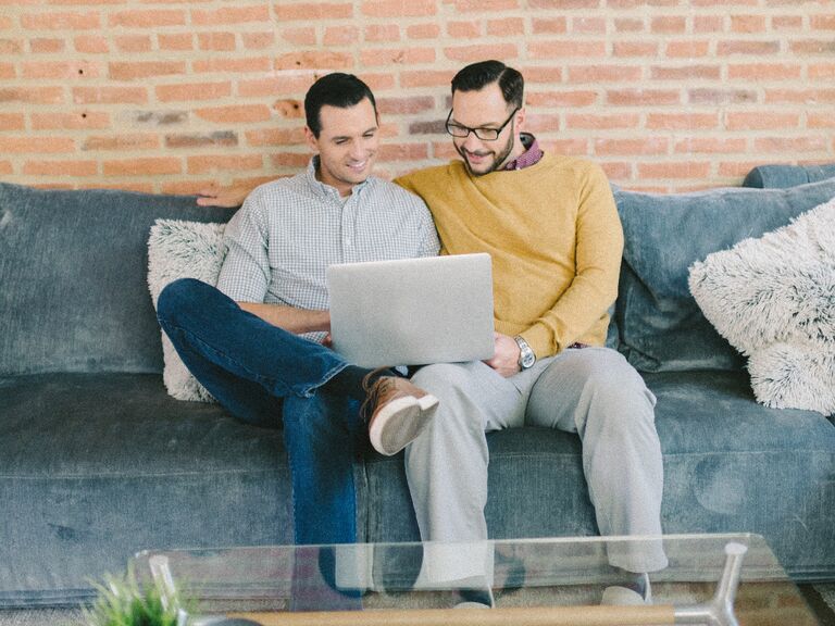 Couple using laptop at home