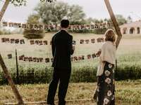 Wedding guests enjoying picture display