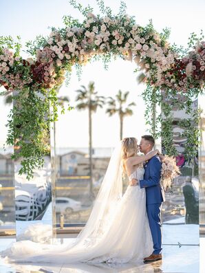 Couple Kissing Under Mirrored Arch at the Hilton Waterfront Beach Resort in Huntington Beach, California
