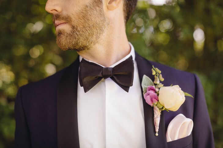 Brandon wore a custom dark blue tuxedo by Tiger of Sweden with black lapels and a black bow tie. His boutonniere was made up of an ivory peony and a pink orchid.