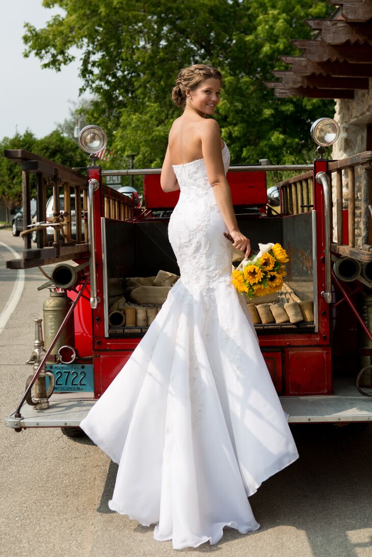Since EJ is a firefighter, the couple posed for post-ceremony pictures on a fire truck.