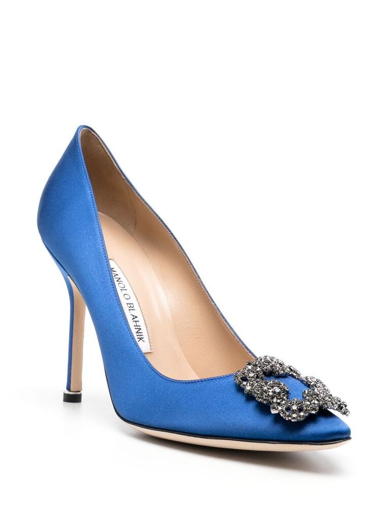 Tall blue pumps with a crystal embellishment on the toe. 