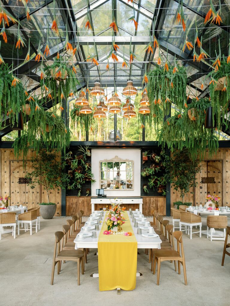 Breakfast reception with hanging flowers and yellow linens