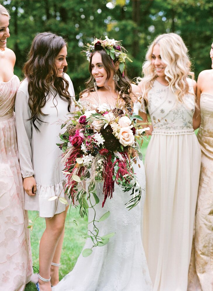 Clusters of roses, dahlias, stephanotis and hanging amaranthus created an overflowing burgundy bridal arrangement. "I wanted my flowers to be wild-looking and romantic instead of a round, perfect bouquet," Lauren says. "It turned out gorgeous—but it was heavy!"