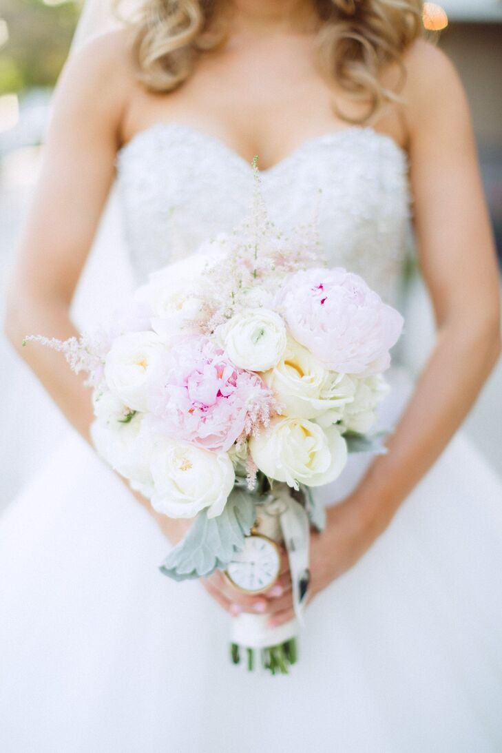 The bridal bouquet was a lovely, soft arrangement of white and pink peonies, ranunculuses and roses.