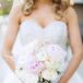 The bridal bouquet was a lovely, soft arrangement of white and pink peonies, ranunculuses and roses.