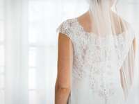 Bride in wedding dress looking away from the camera. 