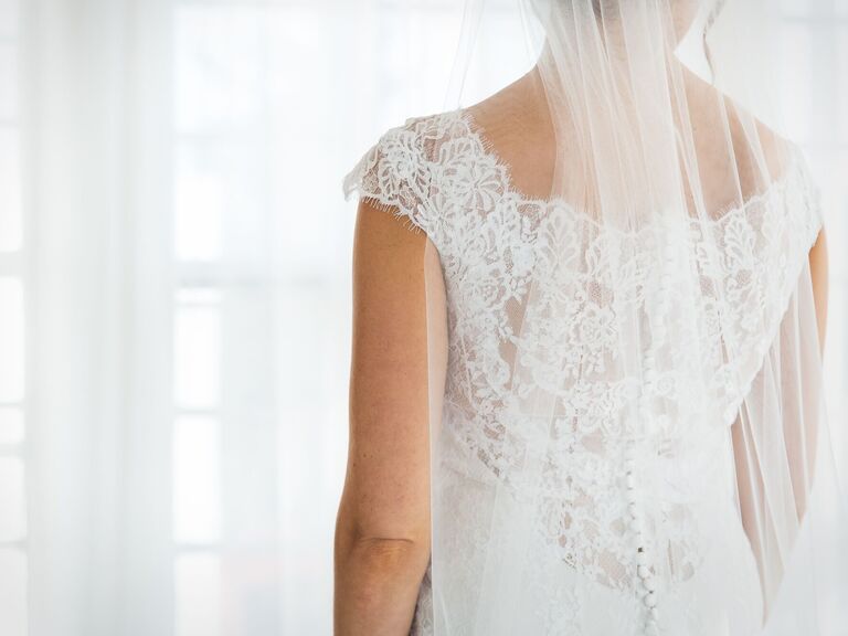 Bride in wedding dress looking away from the camera. 