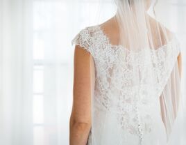 Bride in wedding dress looking away from the camera. 