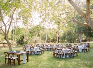 Outdoor Reception with Dark Chiavari Chairs and Blue Patterned Tableclothes