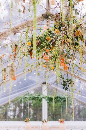 Hanging Flower Arrangements With Orange Flowers and Greenery