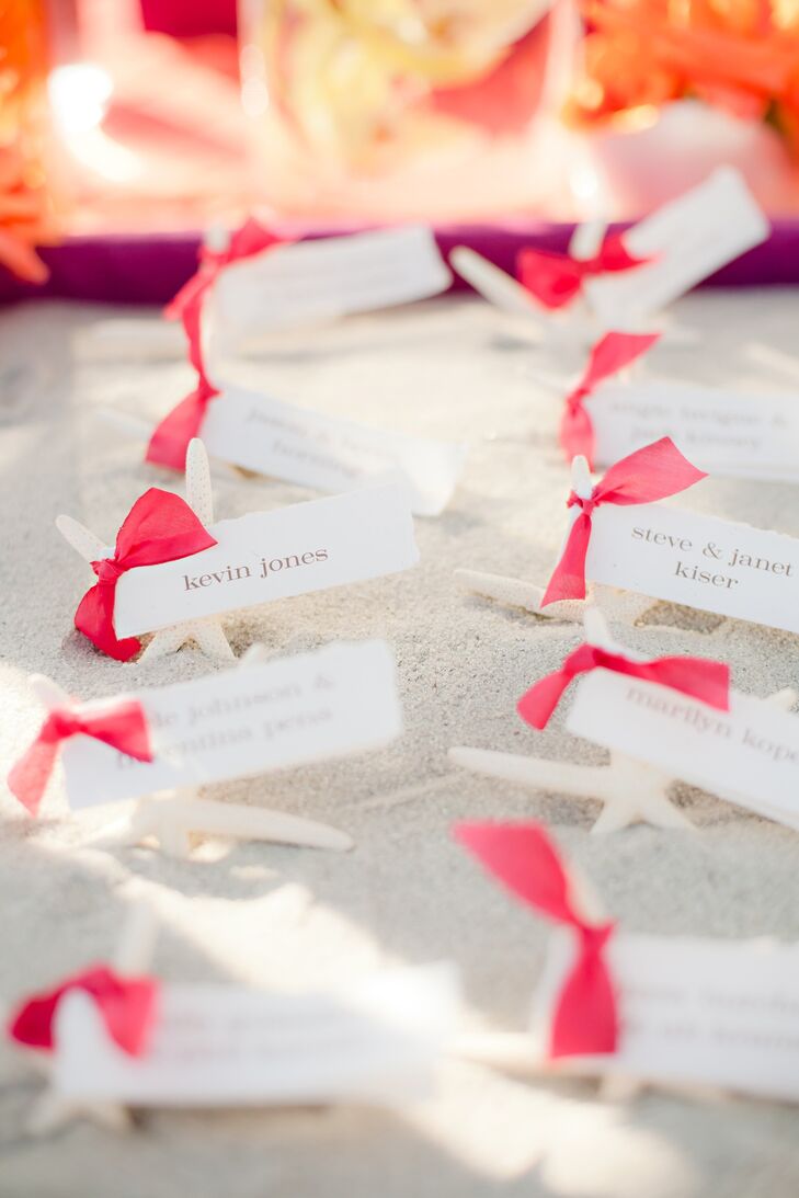 The escort cards were tied to starfish and displayed in sandboxes.