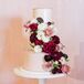 Wedding Cake With Burgundy and Blush Flowers