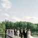 Guests Toasting With Glasses Over Long Reception Table