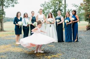 Bridesmaids Dressed in Blue and Whimsical Flower Girl
