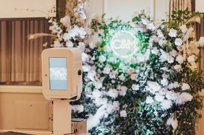 Elegant Photo Booth with Flower Wall and Monogram Neon Sign