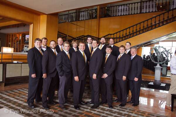 Groomsmen In Black Suits And Gold Ties