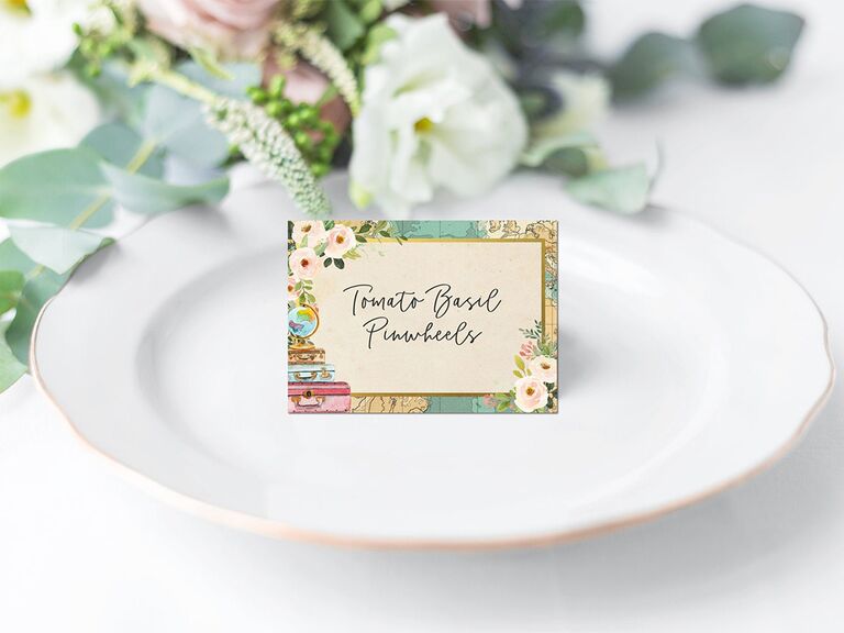 Card with map border and white florals and luggage icons