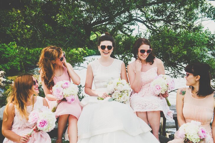 Katie and her bridesmaids wore heart-shaped sunglasses as they happily sat next to each other, with their bouquets resting in their laps. "The girls wore whatever pink dress they wanted," Katie says. "I wanted to be able to see the individuality that I love about all of them."