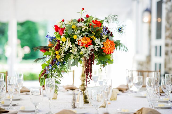 A gold compote was filled with an assortment of garden rose, ruscus, zinnia, tulip, hydrangea and gomphrena.