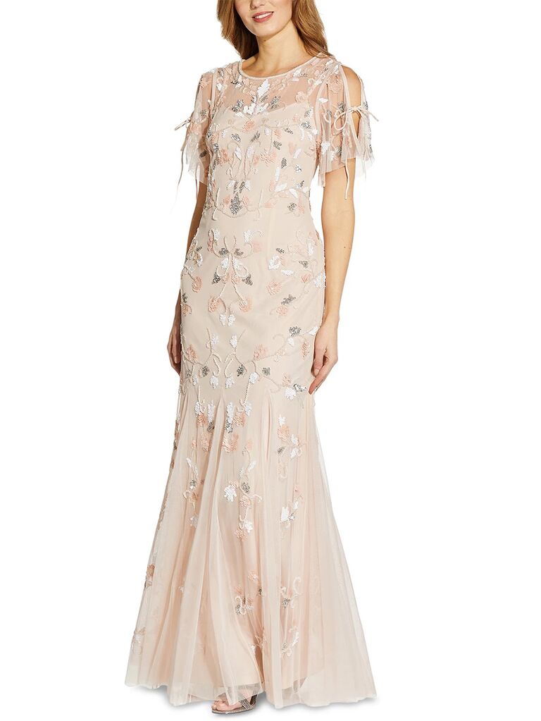 Floor length gown with scoop neck, flutter sleeves and floral beaded detail