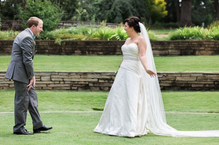 Mary Kait chose this stunning A-line dress for her natural wedding. She loved that it correlated with how she dresses day-to-day: basic with accessories. She added on the pearl belt, lace veil and pale blue shoes.