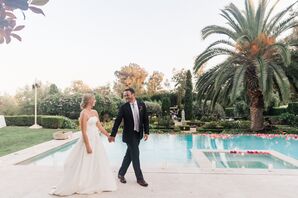 Bride in Strapless Custom Italian Crepe Wedding Dress and Groom in Classic Black Suit Walk at Estate Venue, Pool