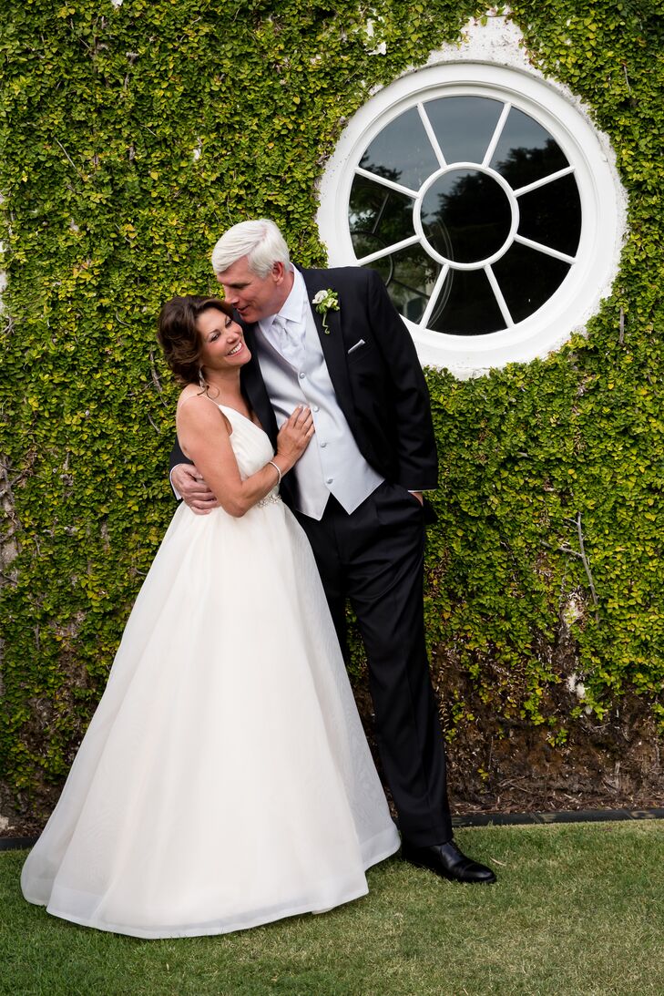 "Paul found my dress. I just love that," Amy says. "I know it's not traditional, but this wasn't our first rodeo so we decided to do what worked for the two of us." The couple were dress shopping at Rylan Lang Bridal in Nebraska, near her old home, when Paul pulled out a classic A-line wedding dress. Designed by Hayley Paige with a V-neckline and simple detailing, the dress was just right for their traditional church ceremony and bright reception.