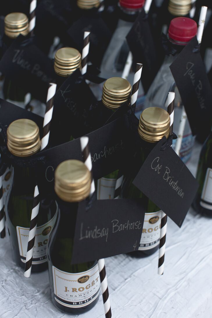 Mini champagne bottles with black-and-white-striped straws served as escort cards at cocktail hour. The highlight? Natalie created a Chex Mix bar—Mark's favorite.