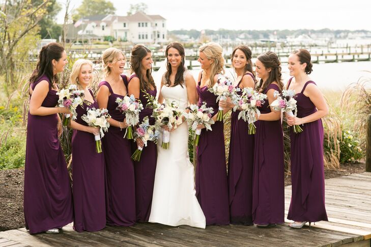 "I wanted them to be comfortable since it was going to be a long day, and the Jersey-style dress seemed like the right choice," Caitlin says of her merlot colored Amsale bridesmaid dresses.