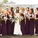 "I wanted them to be comfortable since it was going to be a long day, and the Jersey-style dress seemed like the right choice," Caitlin says of her merlot colored Amsale bridesmaid dresses.