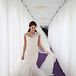 Colleen wore an ivory Reem Acra wedding dress in a mermaid style, which had a beautiful lace pattern on the sleeves that trickled all the was down to where the tulle skirt flared out. She also wore a long ivory tulle veil to complement the look.