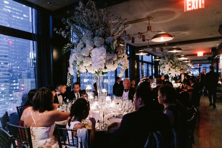 Restaurant Reception with Tall Flower Centerpieces