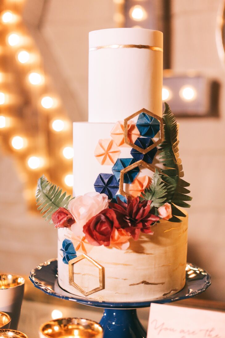 Keeping with the stitching theme, the ivory wedding cake showcased a cascade of hexagonal shapes designed to resemble quilt squares.